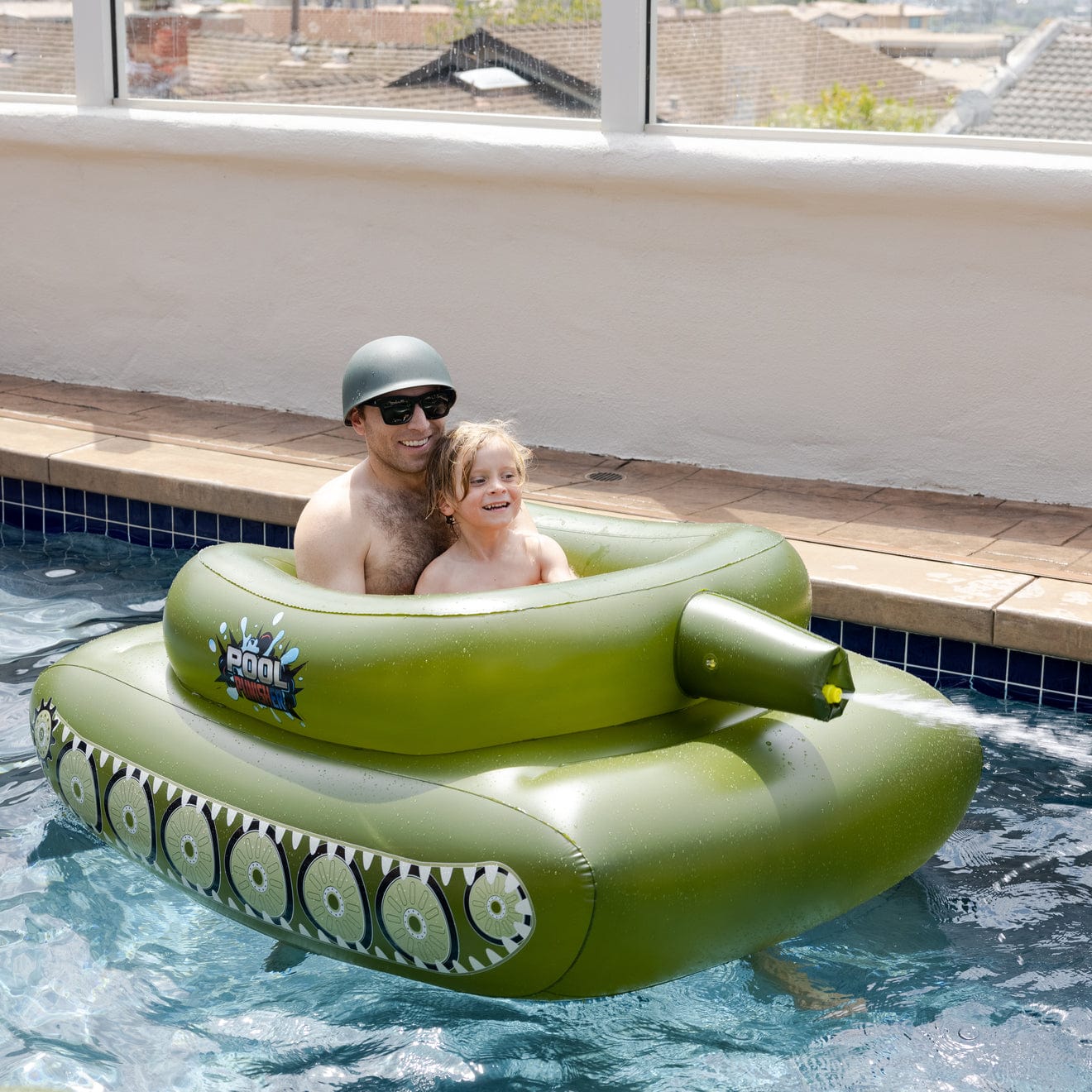 Pool float with clearance water gun